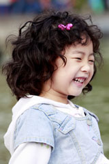 young Asian girl laughing