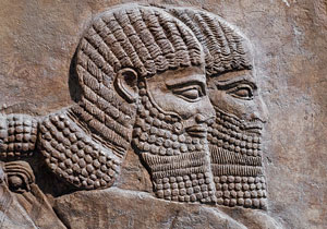 ancient carving of two Assyrian warriors